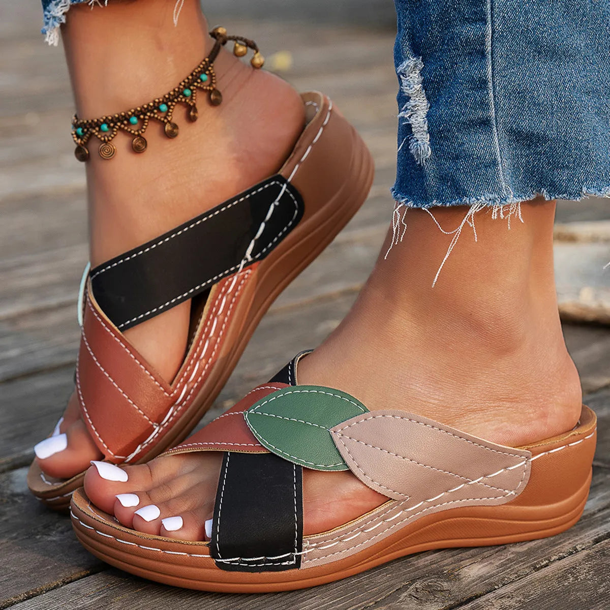 Women's black casual slipper with cross-strap and thick sole, open toe design