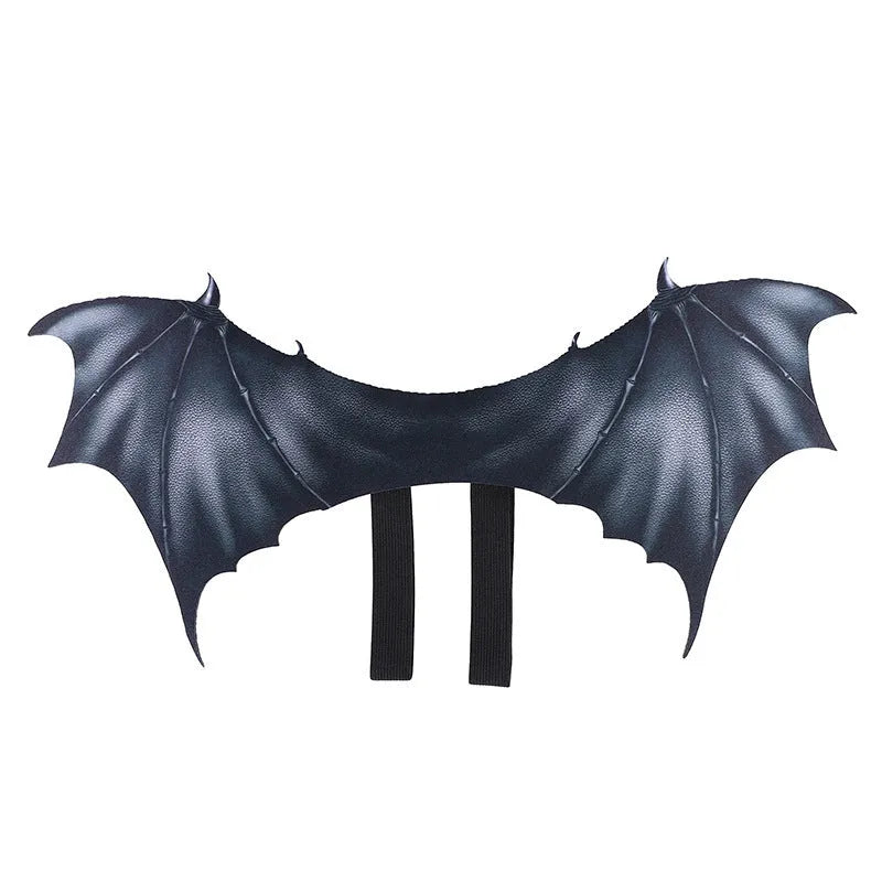 Black cloth bat wing costume for dog or cat on Halloween, shown in three sizes.