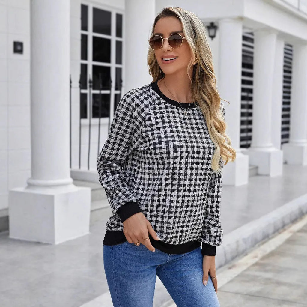 Black plaid pullover sweater with long sleeves and Japanese-inspired printed pattern