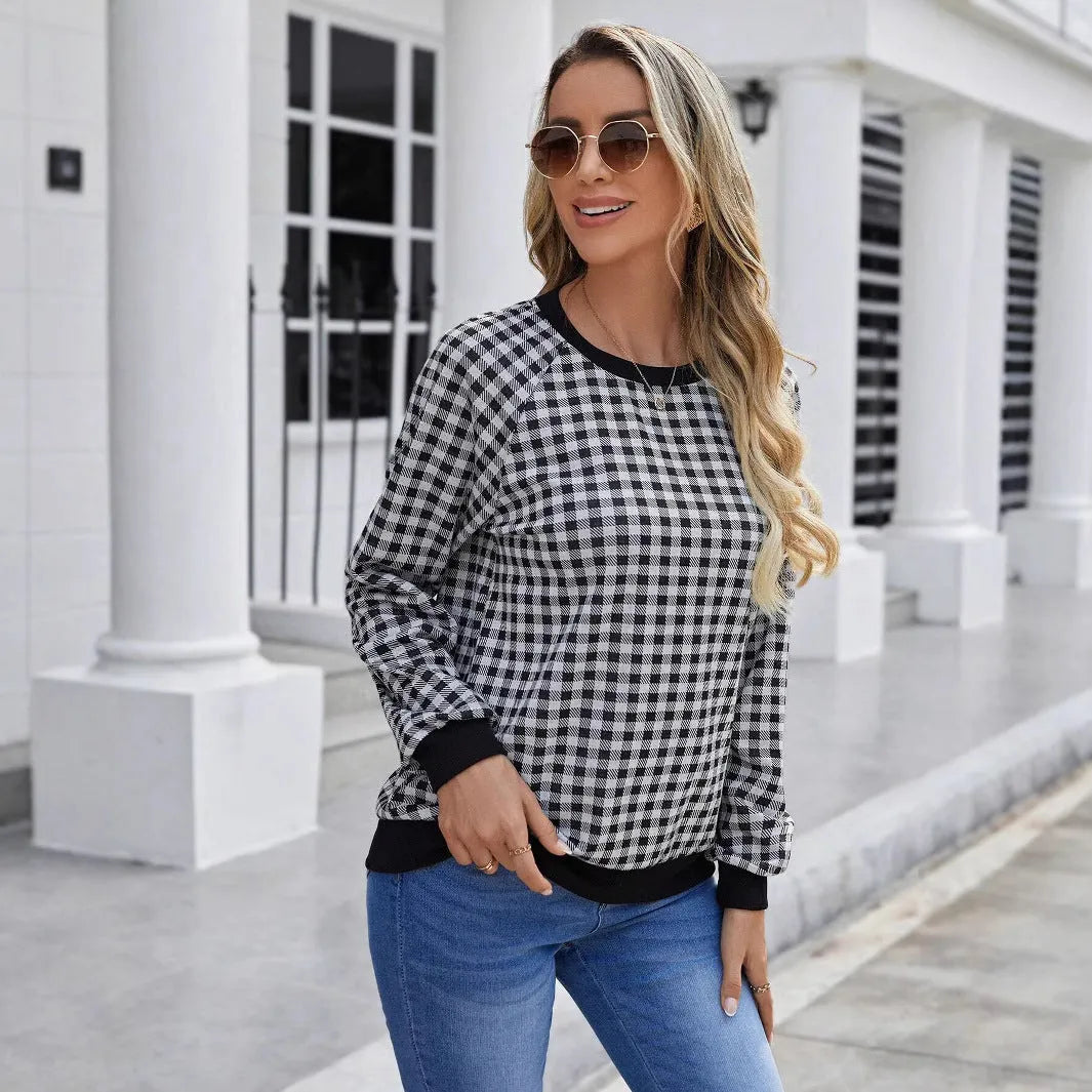 Black plaid pullover sweater with long sleeves and Japanese-inspired printed pattern