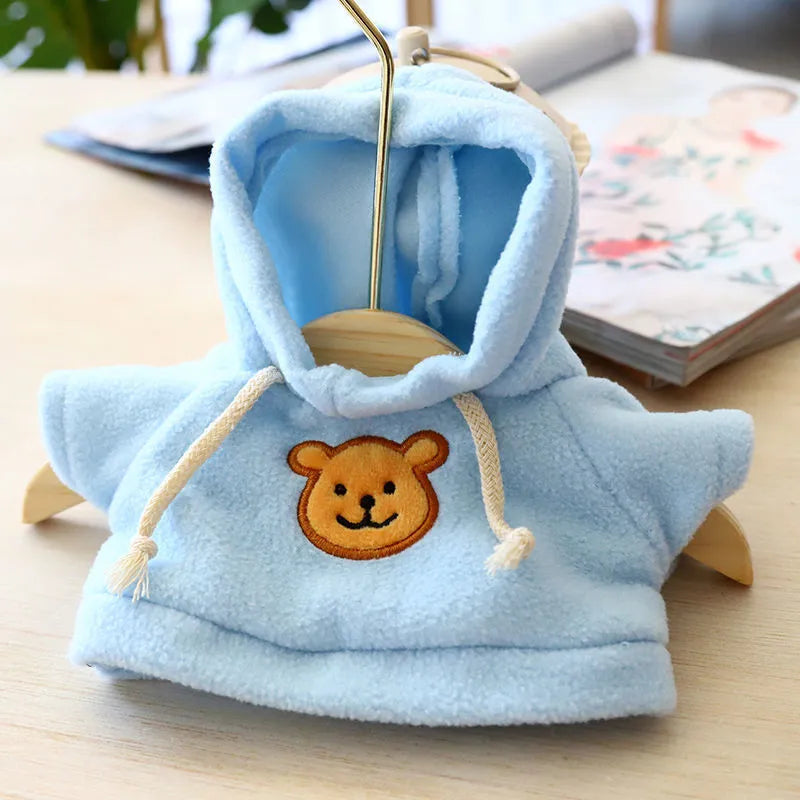 Dog wearing a cloth balaclava hoodie sweater available in blue, pink, red, yellow, brown, or grey bear design
