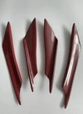 Set of four carbon fibre pattern ABS plastic bumper blades for car modification.