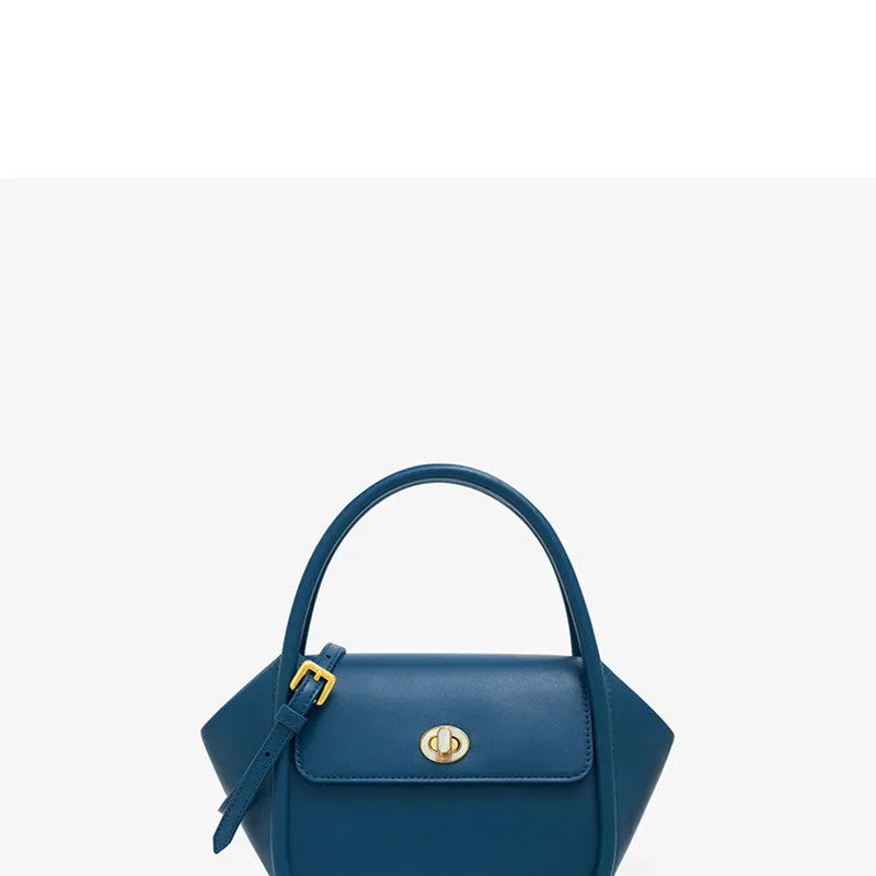 A wing-shaped women's leather tote bag with a buckle latch, shown in blue with a cross-body strap.