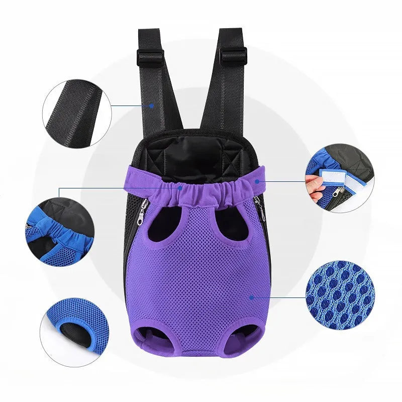 A person wearing a black nylon dog carrier backpack with a small dog looking out from the open top.