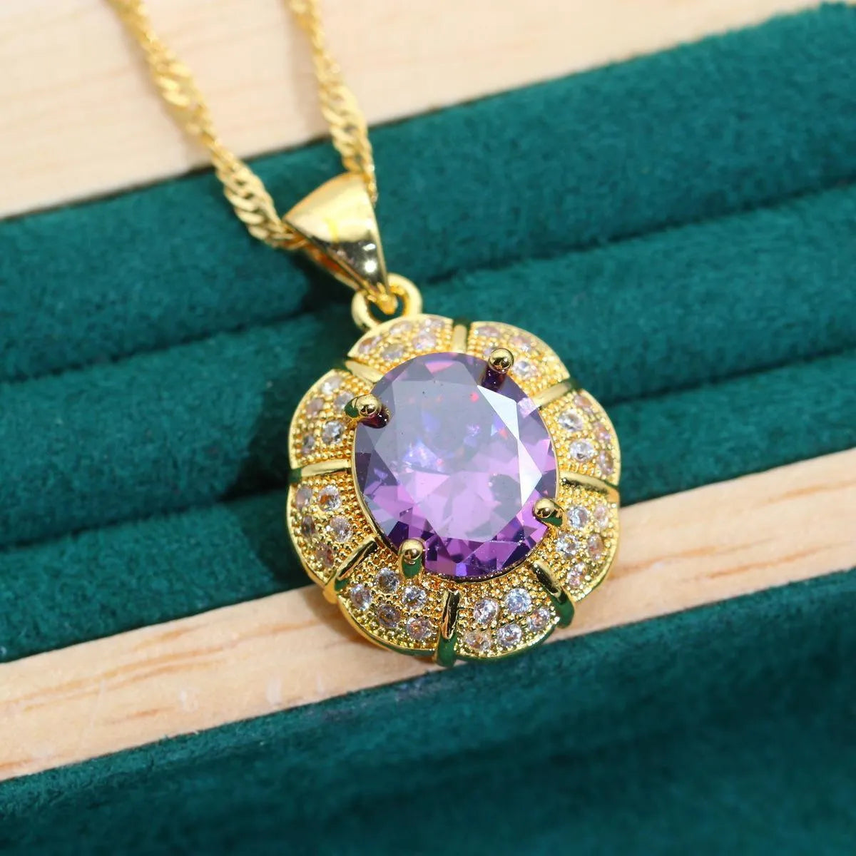 Gold plated jewellery set with multi-colour cubic zirconia stones, showing necklace, earrings, ring, and bracelet.