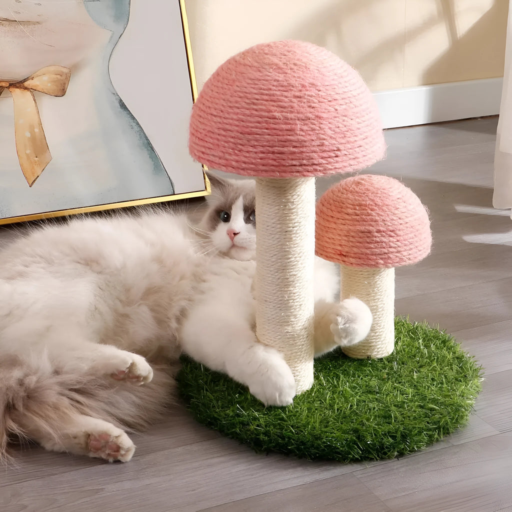 Pink mushroom-shaped cat scratching post with natural sisal cap and pole on a sturdy base.