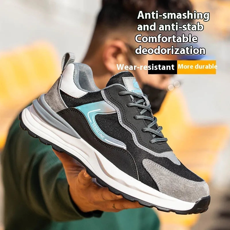 Men's low-top grey work shoes with shoelaces, featuring a plastic steel toe and a mesh and leather upper.