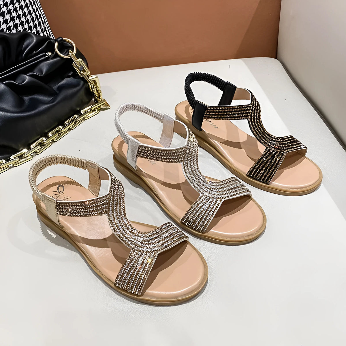 Gold patent leather women's thong sandals with rhinestone accents and a non-slip sole.