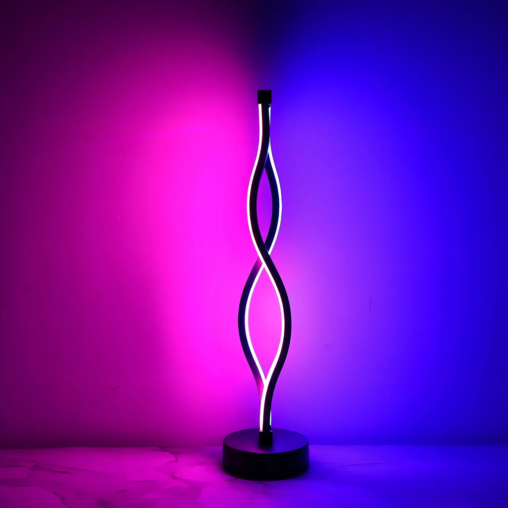 Black aluminium desk lamp with touch dimming and a three-colour button on a desktop