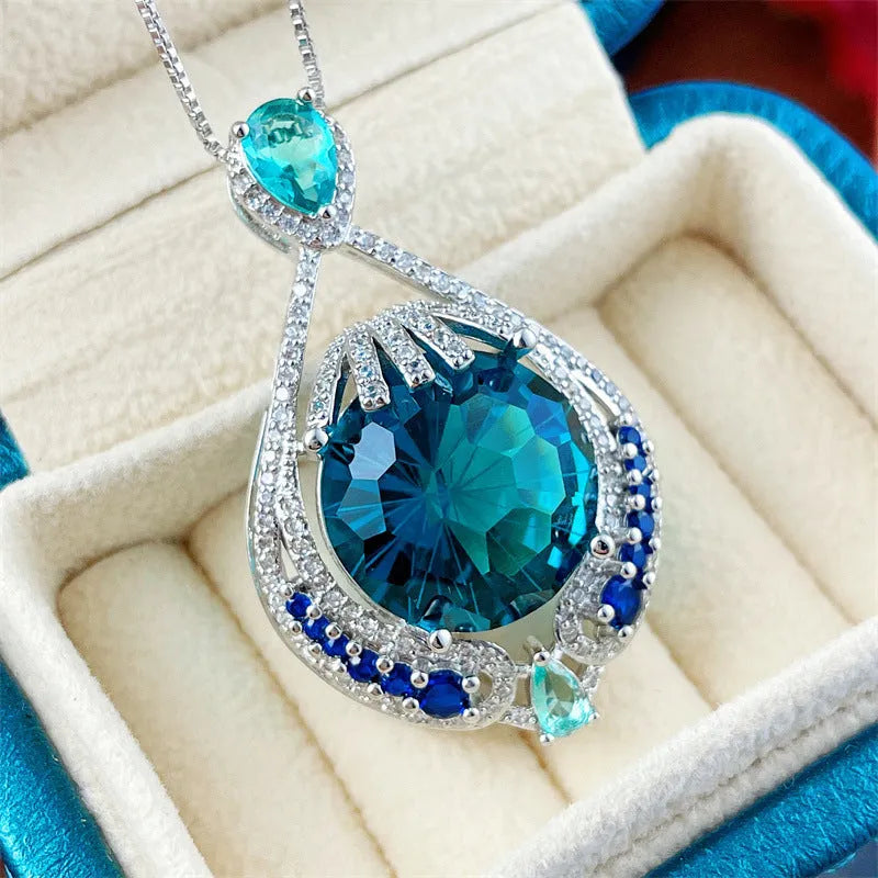 Blue geometric pendant necklace with fireworks cut crystal on a water wave alloy chain for women