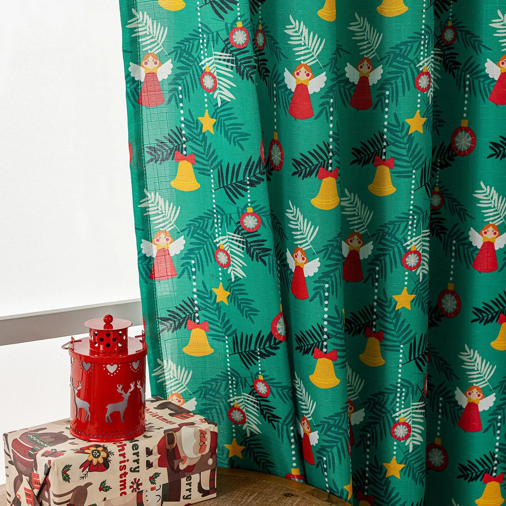 Green Christmas curtain with printed cartoon snowman and angel figures