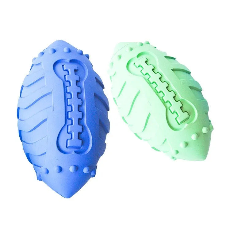 Light green thickened rubber rugby ball dog toy with squeaker for bite-resistant interactive training and teeth cleaning.