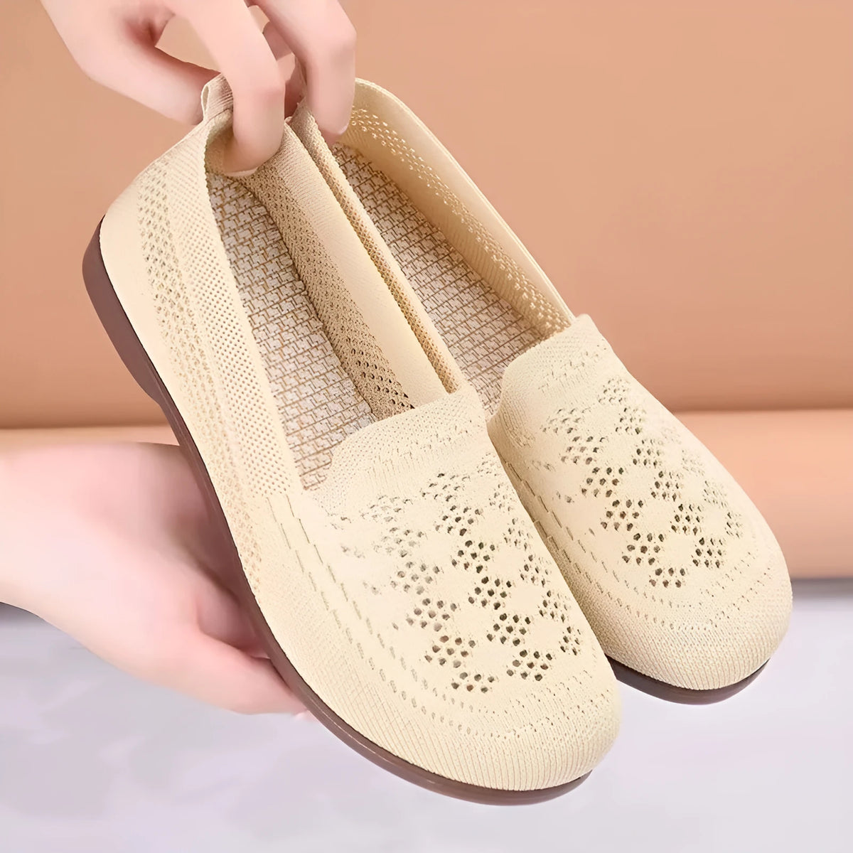 Beige low-top mesh casual trainers for women with a round toe and flat PVC sole.