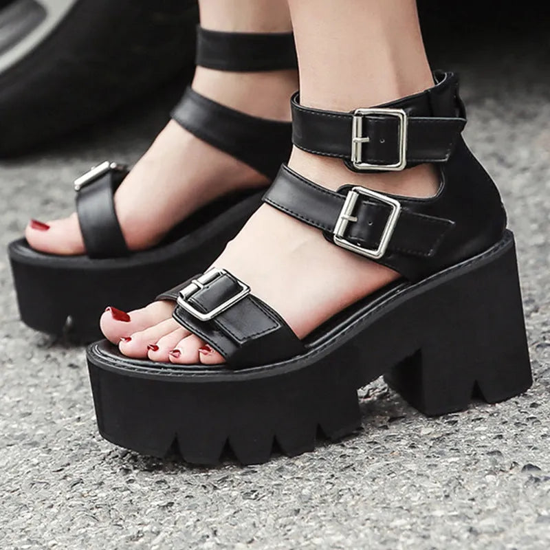 Black women's platform sandals with thick sole, chunky heel, buckle straps and round toe in Harajuku punk style