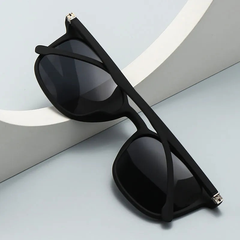 Men's polarised sunglasses with PC frame, spectacle foot design, and dark lenses showing UV400 protection