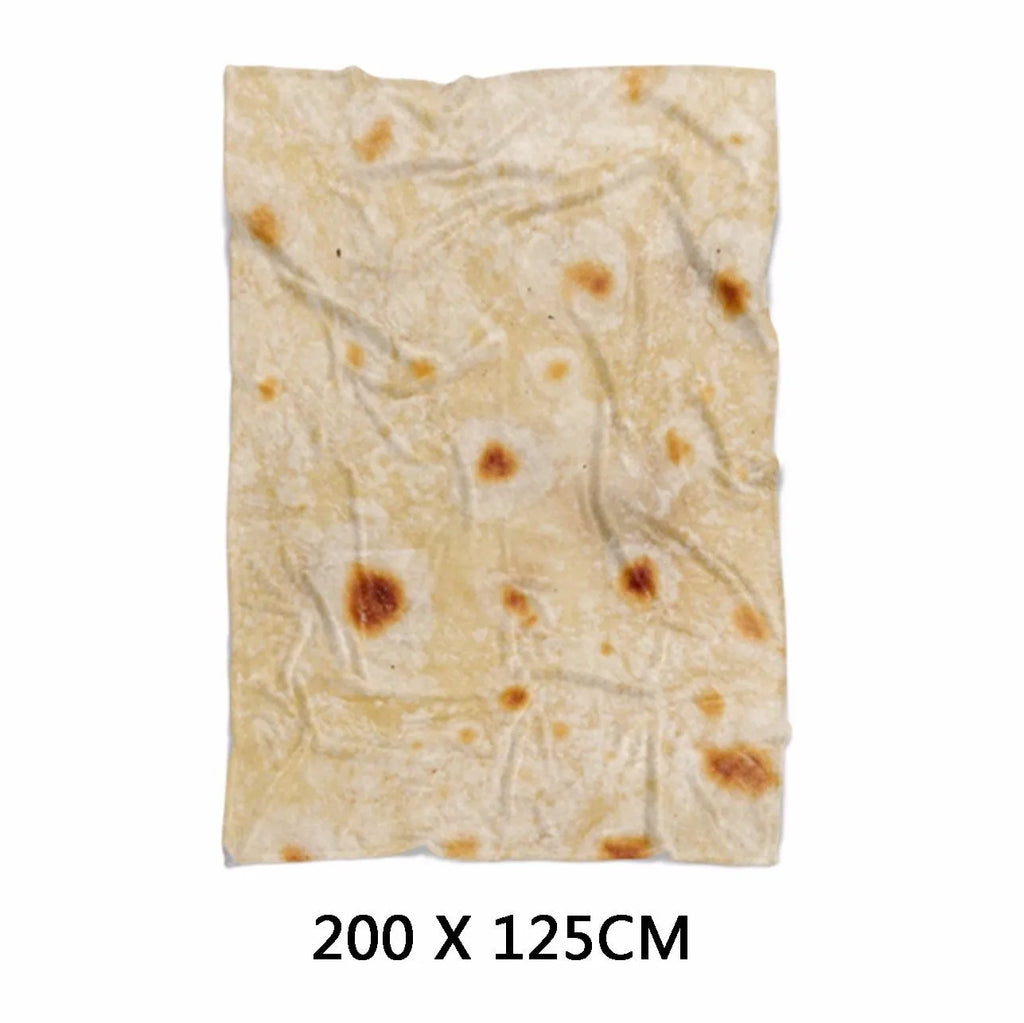 Round coral-coloured flannel burrito blanket with a delicious food print, folded to show soft texture.