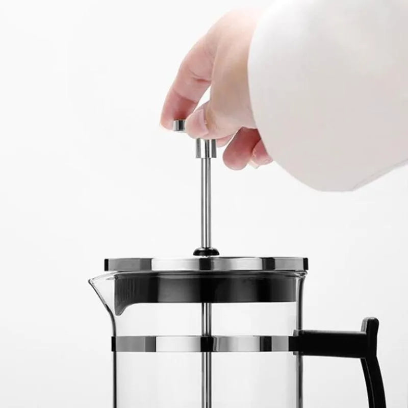 Glass French press coffee maker with stainless steel plunger showing 350ml capacity markings