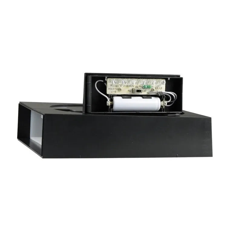 Solar-powered white LED house number light with IP65 waterproof rating mounted on an outdoor wall.