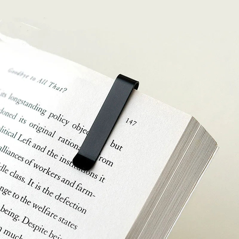 RUMA black aluminium ruler bookmark showing 15cm laser-engraved scale