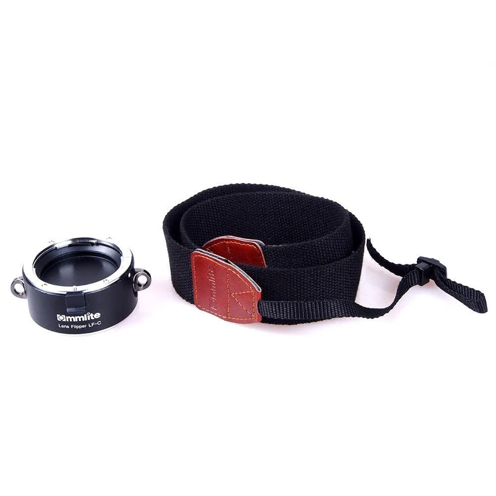 Aluminium camera lens flipper holder for Nikon F-mount with cotton shoulder strap.