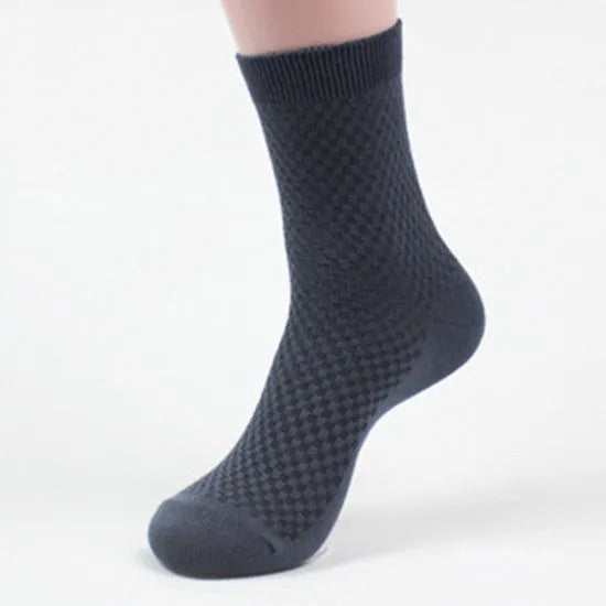 Men's black bamboo fibre socks with small square pattern on ankle
