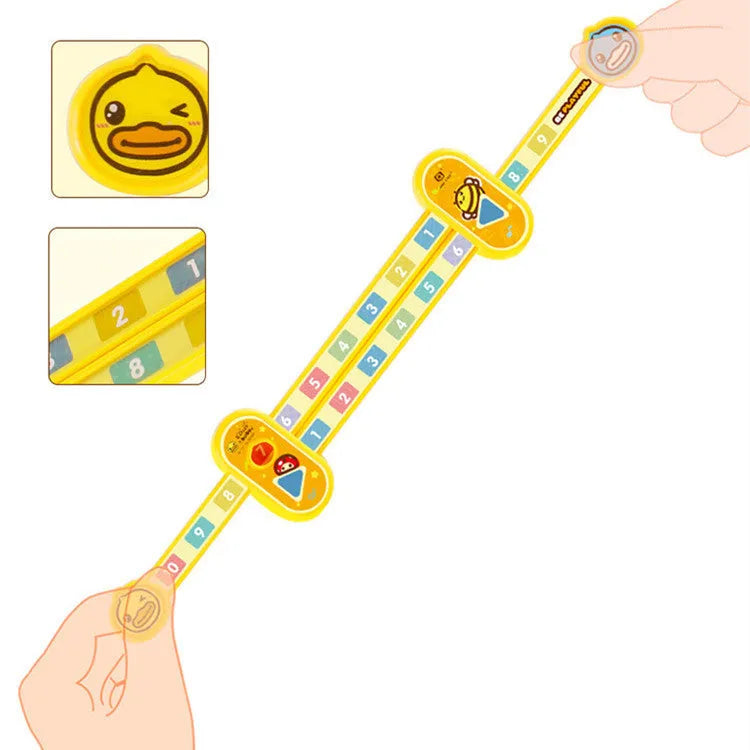 Yellow plastic children's digital decomposition ruler with cartoon graphics, showing 24.5 cm length.