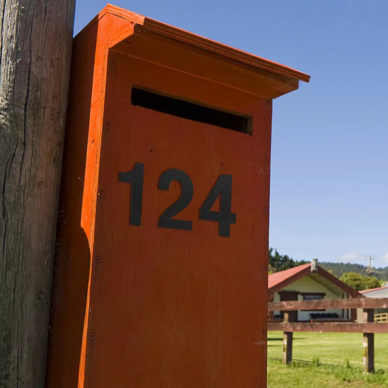 Black stainless steel self-adhesive house number sign showing the digit 7, 7.5cm tall.