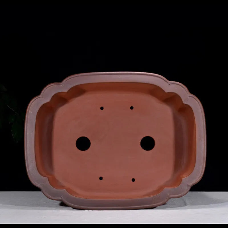 Large antique-look purple clay flowerpot with Chinese tree stump and floral patterns.
