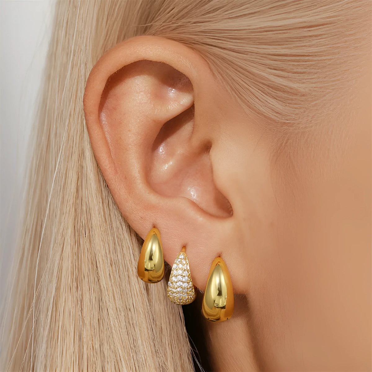 Geometric brass earclip earrings with round design in gold electroplated finish