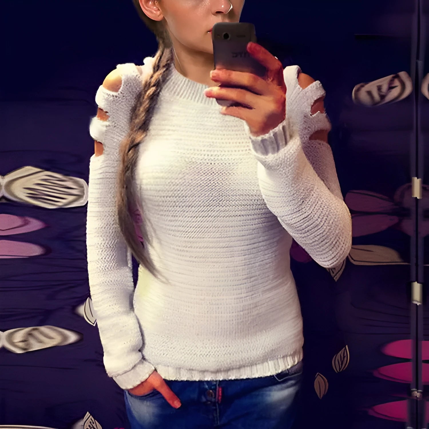 Women's white knitted shirt with hollow-out crochet detail on sleeves and body.