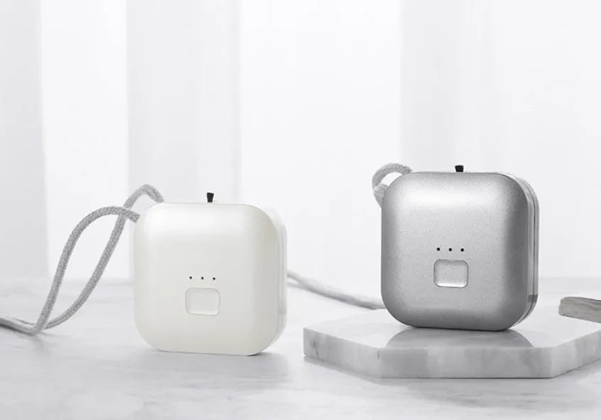 USB rechargeable wearable air purifier necklace in blue colour showing compact dimensions