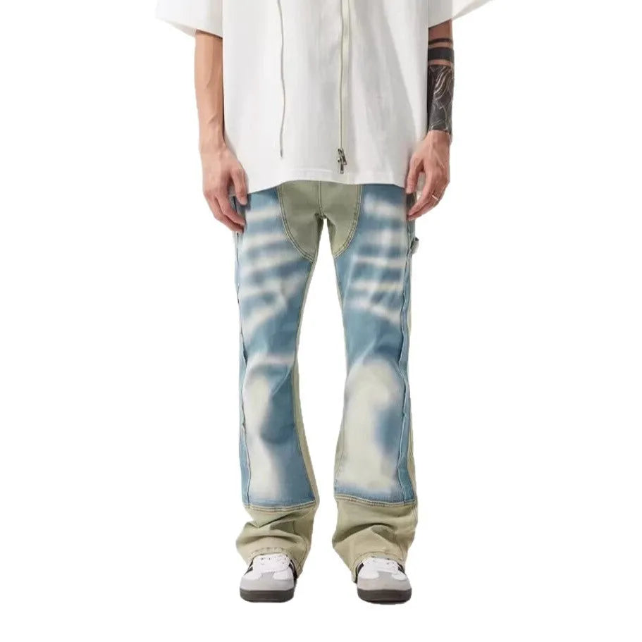 Yellow and blue retro jeans with patchwork and splash-ink damaged design, mid-waist cut.