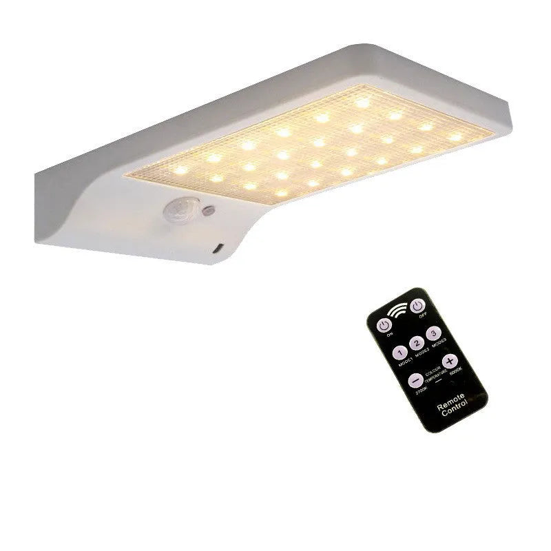 Black and white waterproof solar garden light with LED illumination for outdoor use