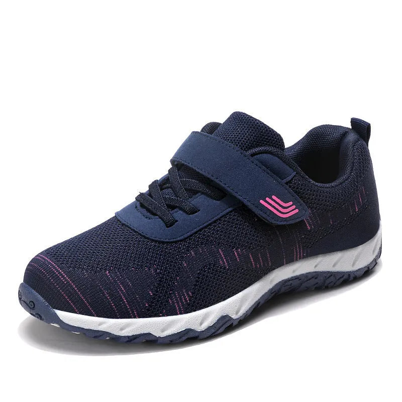 Women's grey purple wedge heel shoes with a mesh upper and velcro strap fastening.