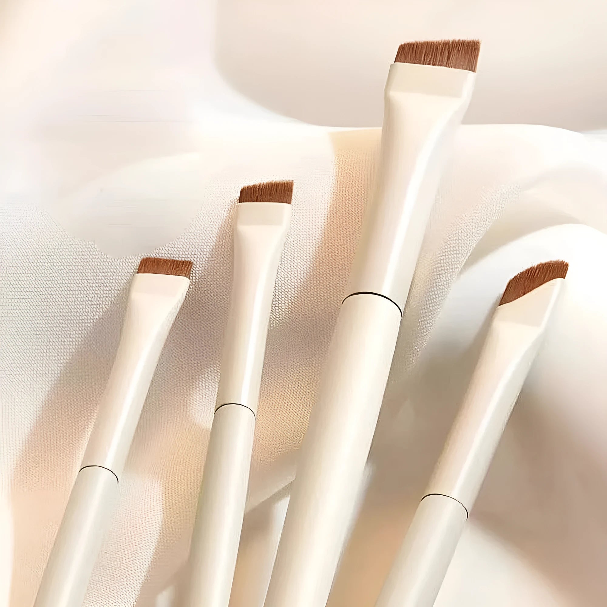 Four angled eyeliner and brow brushes with ultra thin tips in leather case