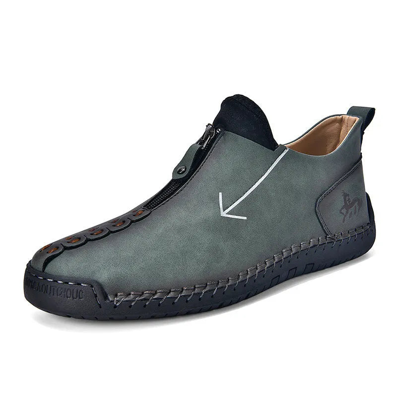 Men's black zip-up casual leather boots with round toe and hand-stitched rubber sole.