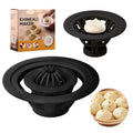 Black Jinkali set of four plastic steamed bun moulds for shaping dumplings and baozi on a kitchen worktop.