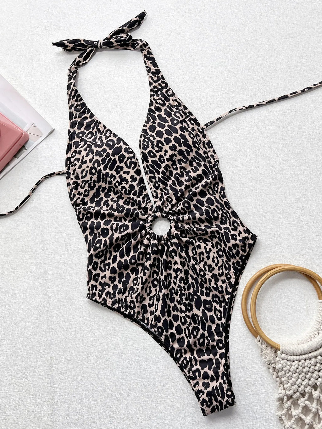 Leopard print women's one-piece swimsuit with hollow-out ring detail on mannequin