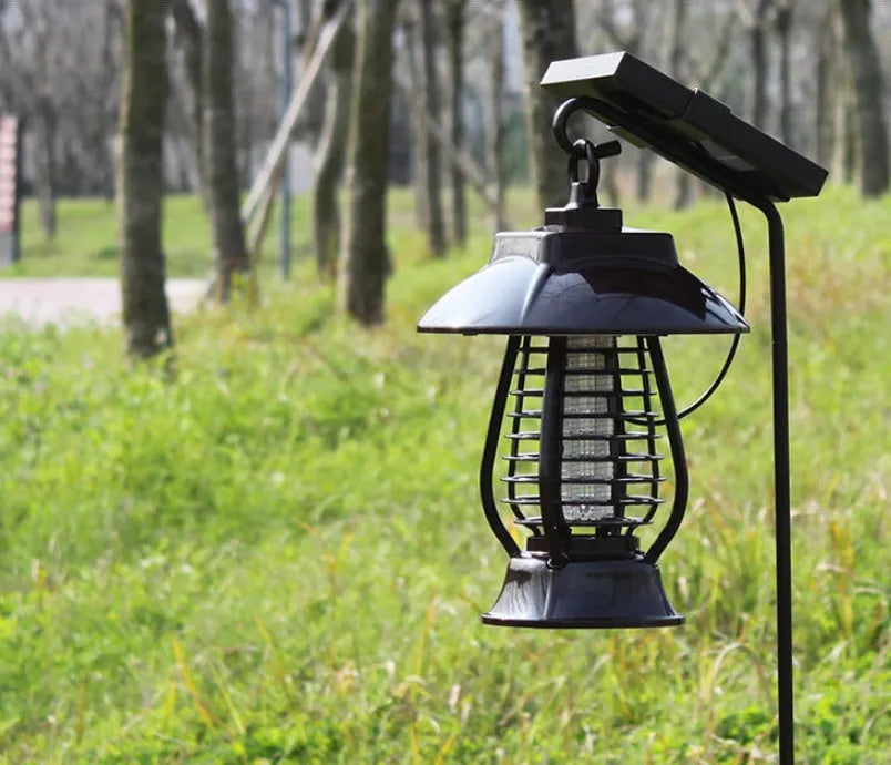 White and black solar mosquito lamp with solar panel, 24 LEDs, and two-way switch for outdoor insect control.