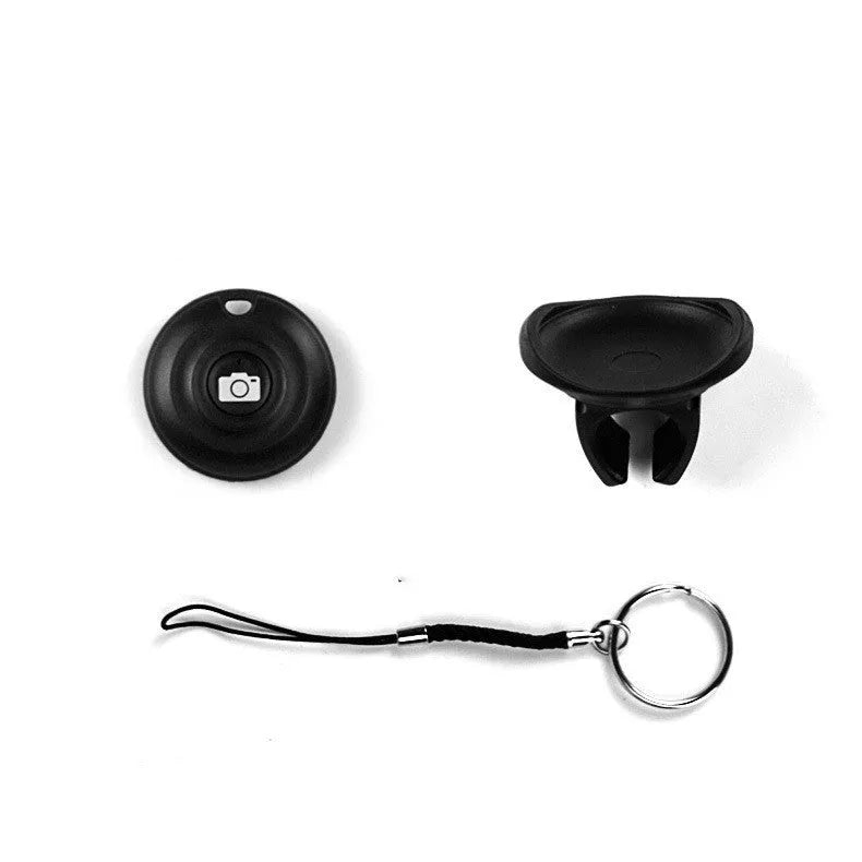 Small black Bluetooth remote control for wireless smartphone camera shutter release.