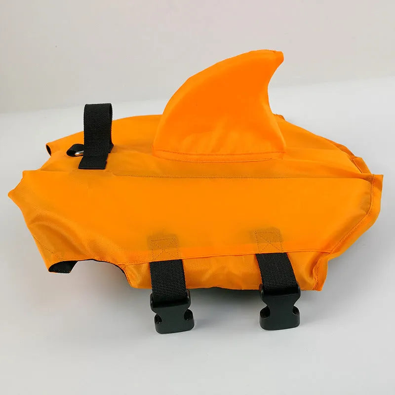 Shark-shaped dog life vest in blue or orange, cloth pet life jacket with buckle, sizes XS to XXL.