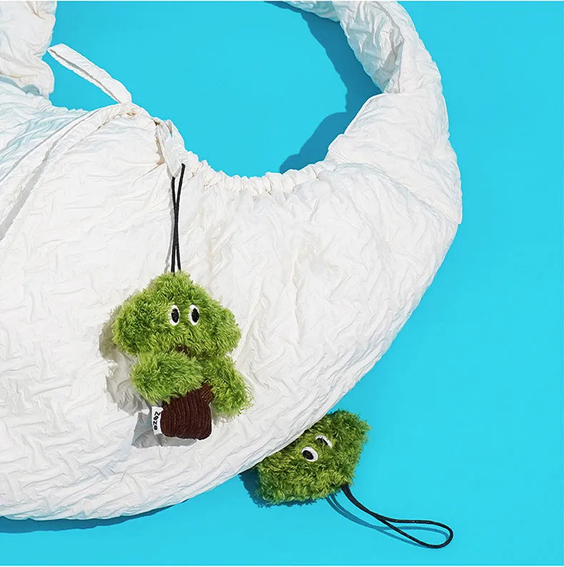 Pine tree-shaped cat chew toy with a dangling pendant, shown in three sizes.