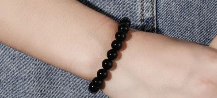 Black onyx geometric bracelet with 8mm beads on a stretchy elastic cord.