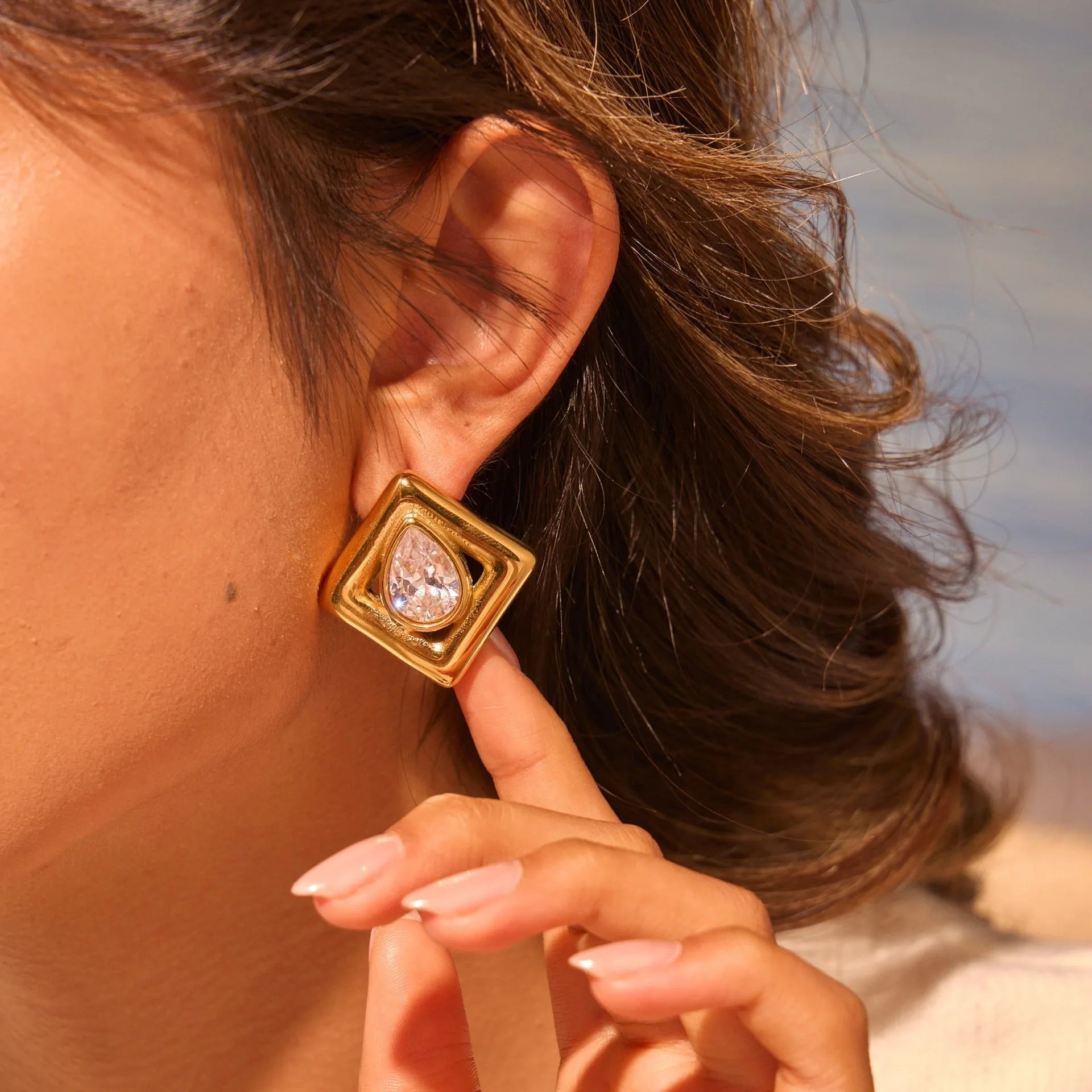 Gold geometric stud earrings with water drop zircon inlays on stainless steel with 18K electroplated finish