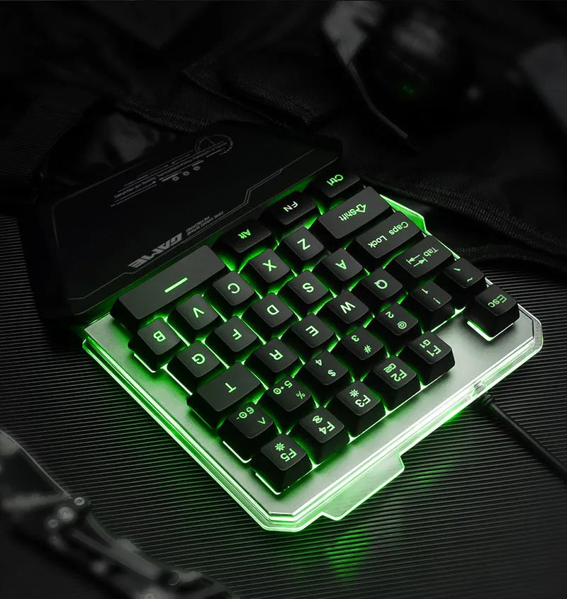 Black robotic one-handed gaming keyboard with RGB backlit keys and USB cable