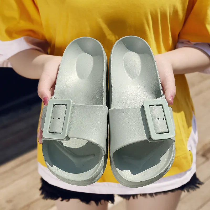 Women's grey blue buckle flip-flop with soft EVA sole and adjustable strap.