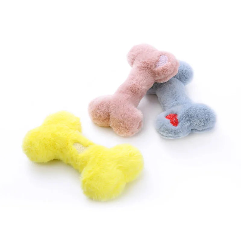 Soft plush dog toy shaped like a bone with a love heart design, in blue colour with a squeaker.