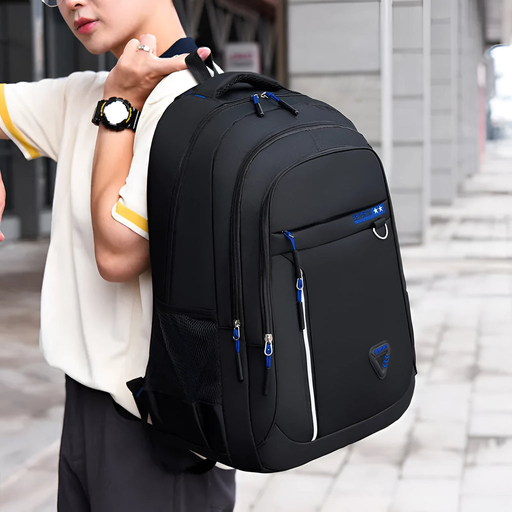 Men's Oxford cloth schoolbag in black with letter pattern detailing showing 20-35L capacity and burden reduction system