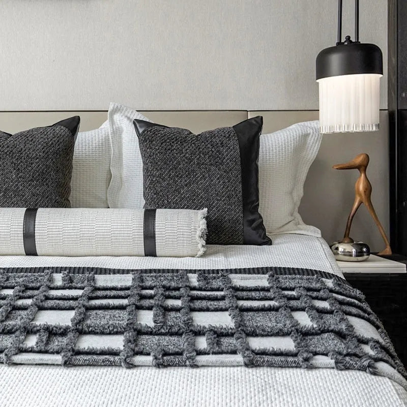 Modern minimalist polyester bed runner blanket set with round pillow and pillowcase on a bed.
