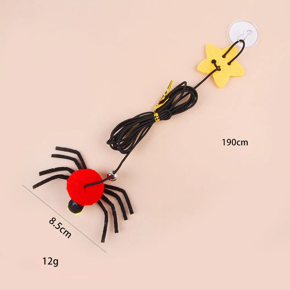 Red and yellow cat hanging door toy with elastic rope, feather, bell, and spider attachment